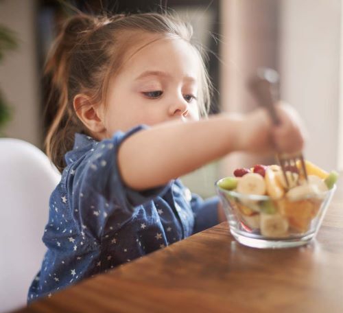 little-girl-eating-fruit